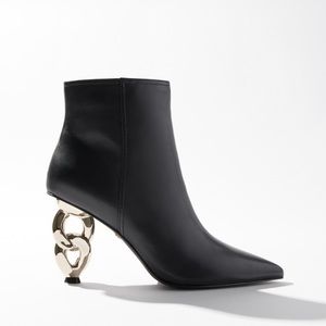 Black leather bootie with gold chain heel. Worn once